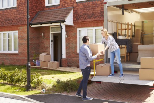 Removal van and movers helping a family move home in Whetstone
