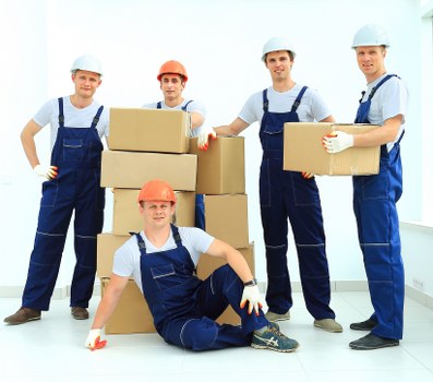 Professional movers handling furniture in a Whetstone property
