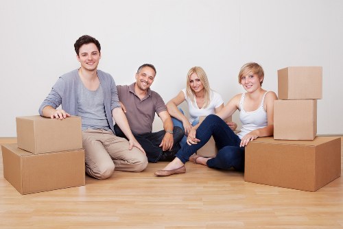 Packed moving boxes and furniture ready for transport in Whetstone